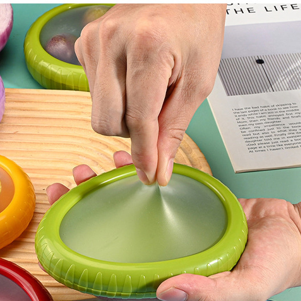 silicone-produce-saver-for-cut-fruit source-proven hand stretch side view