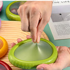silicone-produce-saver-for-cut-fruit source-proven hand stretch side view